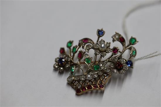 An early 20th century gold and multi gem set guiardinetto (flowers in a basket) brooch, gross 9.9 grams.